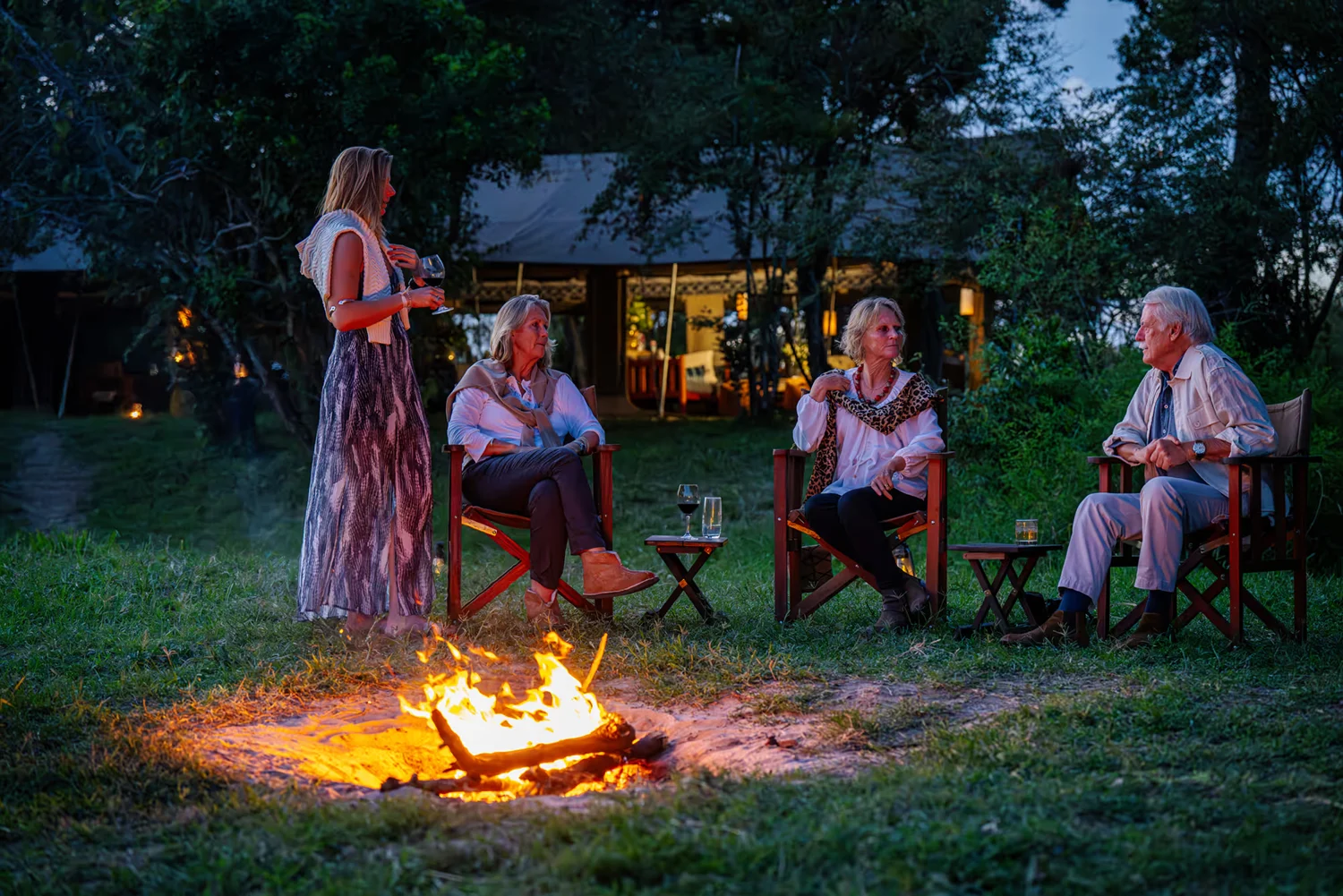 Africa Born guests sharing drinks around the fire